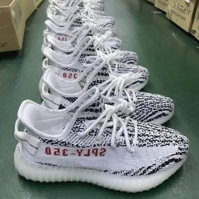 Sneakers in boxes during quality control inspection